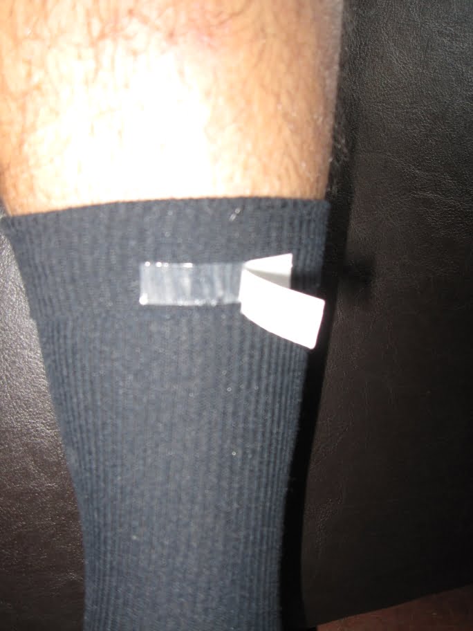 Apply adhesive strip to sock