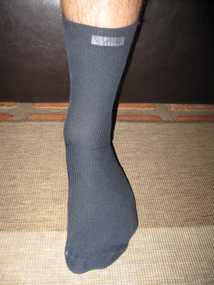 remove backing - fold sock upward to adhere to shin